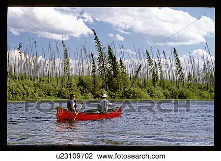 Stock Image - Couple canoeing . Fotosearch