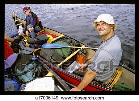Couple canoeing View Large Photo Image Stock Photo - Couple canoeing. Fotosearch