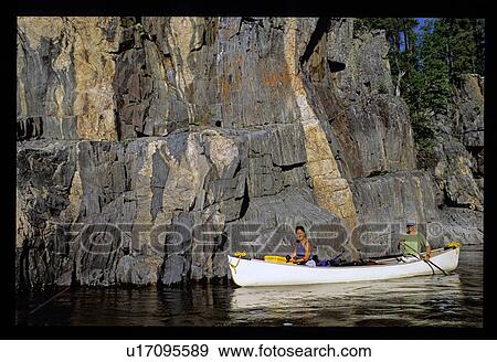 Stock Photo - Couple canoeing . Fotosearch