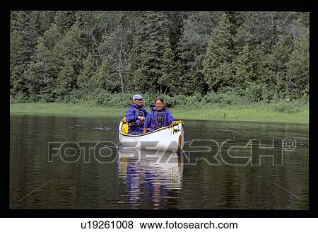 Couple canoeing View Large Photo Image Stock Photo - Couple canoeing . Fotosearch