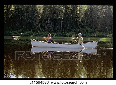 Couple canoeing View Large Photo Image Stock Photograph - Couple canoeing. Fotosearch