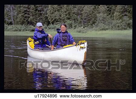 Couple canoeing View Large Photo Image Stock Photograph - Couple canoeing. Fotosearch
