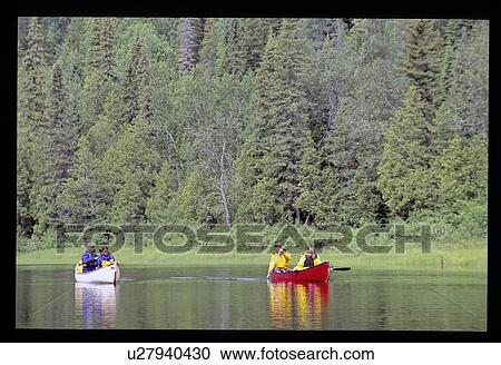 Stock Image - Couples canoeing . Fotosearch