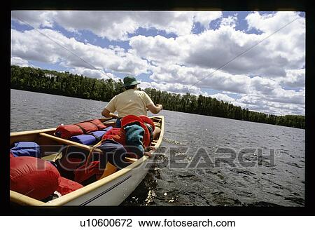Father and son canoeing View Large Photo Image Stock Image - Father and son canoeing . Fotosearch
