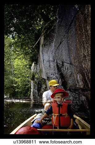 Father and son canoeing View Large Photo Image Stock Image - Father and son canoeing . Fotosearch