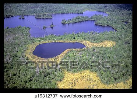 Stock Photo - Flying over a lake. Fotosearch
