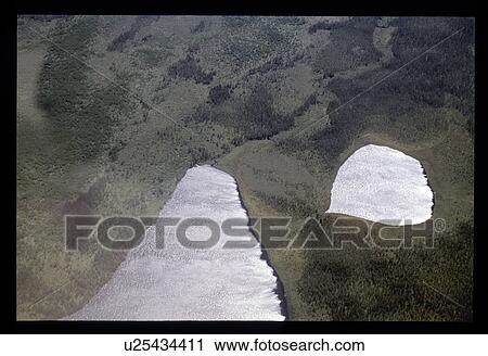 Stock Image - Flying over lakes. Fotosearch