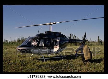 Getting into a helicopter View Large Photo Image Stock Image - Getting into a helicopter . Fotosearch