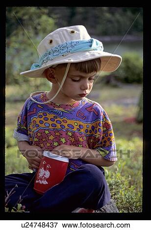 Stock Photo - Girl holding a cup. Fotosearch