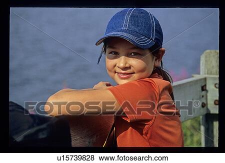 Girl in baseball hat View Large Photo Image Stock Photo - Girl in baseball hat. Fotosearch
