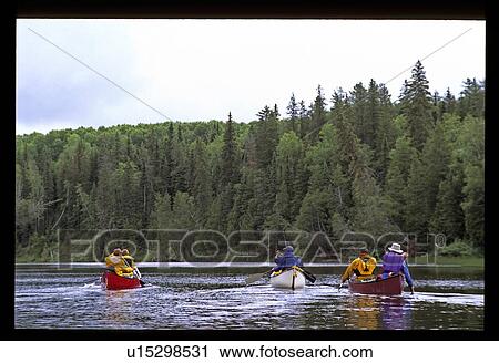 Stock Image - Group canoeing. Fotosearch