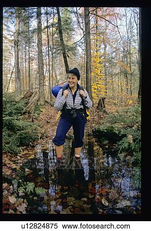 Stock Photography - Hiking in the woods. Fotosearch