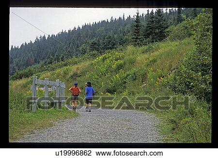 Hiking on a mountain path View Large Photo Image Stock Image - Hiking on a mountain path. Fotosearch