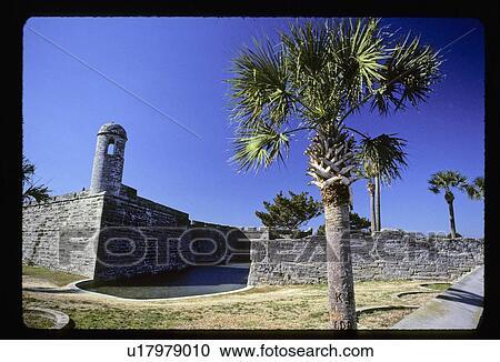 Stock Image - Historic fort with palm trees. Fotosearch