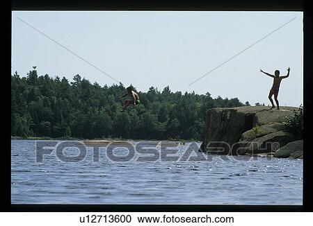 Stock Image - Jumping into a lake. Fotosearch