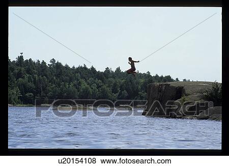Stock Photo - Jumping into a lake. Fotosearch