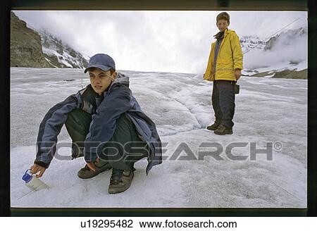 Kids playing on the ice View Large Photo Image Stock Image - Kids playing on the ice. Fotosearch