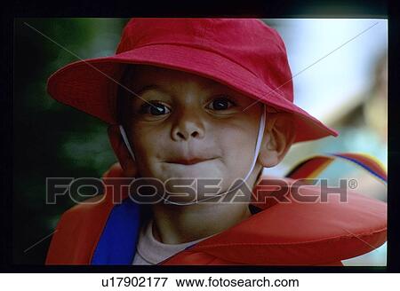 Life vest on a young boy View Large Photo Image Stock Photo - Life vest on a young boy. Fotosearch