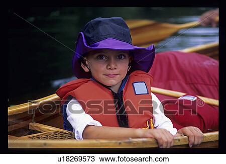 Little boy in canoe View Large Photo Image Stock Image - Little boy in canoe. Fotosearch