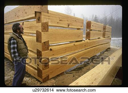 Log cabin being built View Large Photo Image Picture - Log cabin being built. Fotosearch