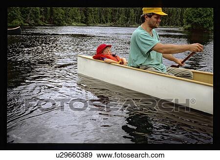 Stock Photo - Man and son canoeing. Fotosearch