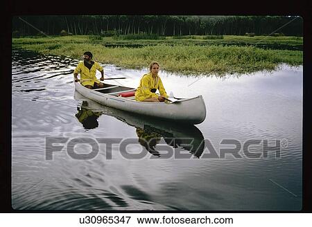 Man and woman canoeing View Large Photo Image Stock Photo - Man and woman canoeing. Fotosearch
