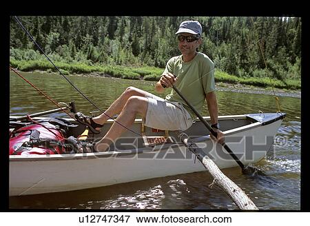Man canoeing View Large Photo Image Stock Photo - Man canoeing . Fotosearch