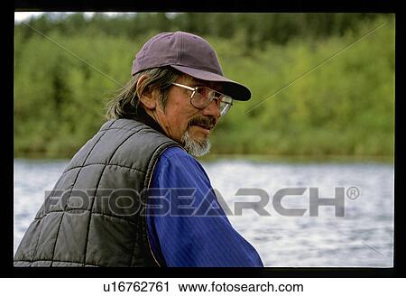 Stock Image - Man in a lake. Fotosearch