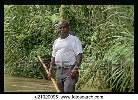 Stock Photography - Man on river raft. Fotosearch