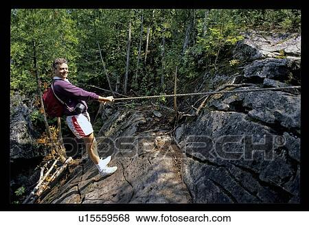 Man rock climbing View Large Photo Image Stock Photo - Man rock climbing. Fotosearch