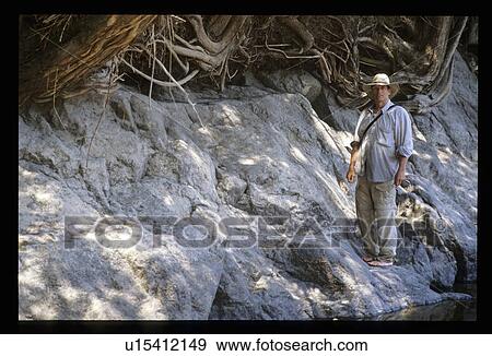 Stock Photo - Man standing on shore. Fotosearch