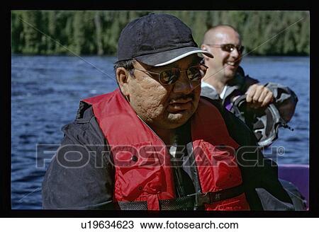 Stock Image - Men canoeing. Fotosearch