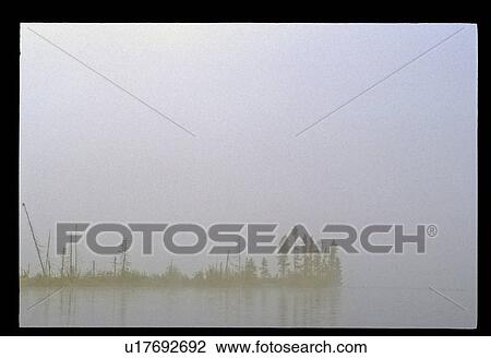 Stock Image - Misty lake. Fotosearch