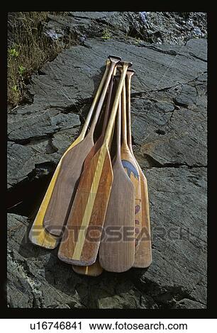 Paddles laying on rock View Large Photo Image Stock Image - Paddles laying on rock. Fotosearch