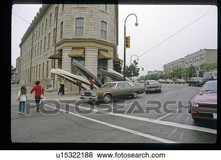 People carrying canoes in a city View Large Photo Image Stock Photo - People carrying canoes in a city. Fotosearch