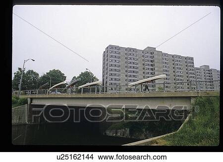 People carrying canoes over a bridge View Large Photo Image Picture - People carrying canoes over a bridge . Fotosearch