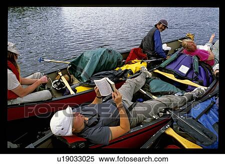 Stock Photography - Reading and canoeing . Fotosearch
