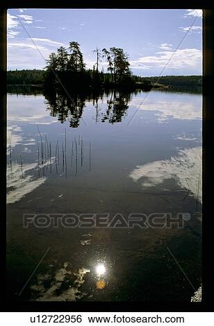 Stock Photograph - Reflective lake. Fotosearch