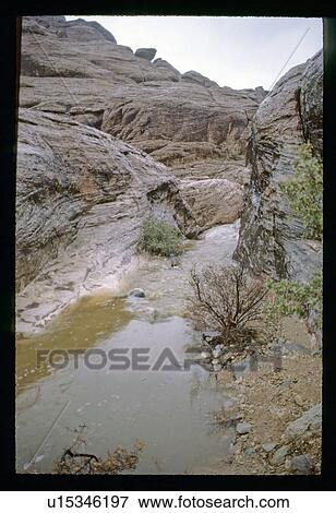 Stock Photo - River through rocks. Fotosearch