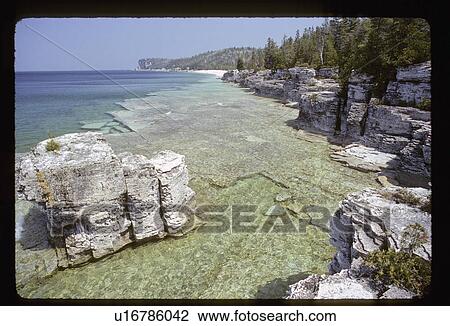 Rock cliffs as a shoreline View Large Photo Image Stock Image - Rock cliffs as a shoreline. Fotosearch