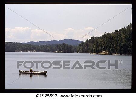 Stock Photo - Rowing in a lake. Fotosearch