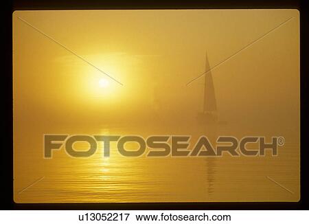 Sailboat at sunset View Large Photo Image Stock Photo - Sailboat at sunset. Fotosearch