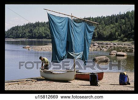 Stock Photo - Sailboat on a shore. Fotosearch