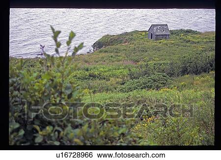 Stock Photograph - Shed by the water. Fotosearch