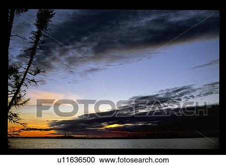 Shoreline at sunset View Large Photo Image Stock Image - Shoreline at sunset. Fotosearch
