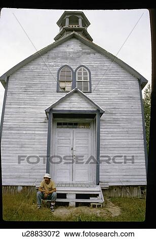 Stock Image - Sitting by an old church. Fotosearch