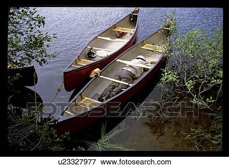Sleeping in a canoe View Large Photo Image Stock Photo - Sleeping in a canoe. Fotosearch