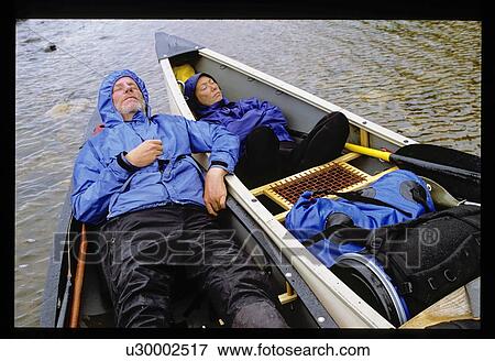 Sleeping in a canoe View Large Photo Image Stock Photo - Sleeping in a canoe . Fotosearch
