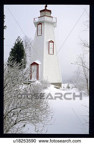Snow covered lighthouse View Large Photo Image Stock Image - Snow covered lighthouse. Fotosearch