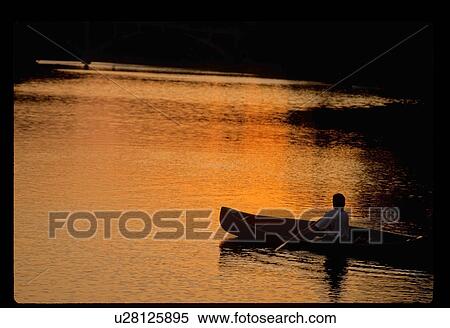 Stock Photography - Sunset canoeing . Fotosearch